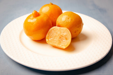 pickled lemon in a white plate