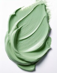 Swirled pale green clay mask, smooth texture.