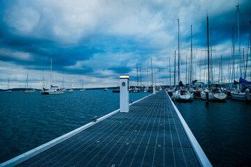 Fototapeta premium Lake Macquarie Yacht Club, home to LMYC Bar and Crusoe’s on the Lake Restaurant, is the perfect venue to dine and catch up with friends while admiring the beautifully unique view across Belmont Bay