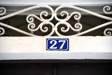 The number 27 above door