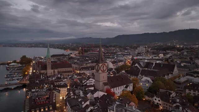 twilight night illumination zurich city center lakeside bay aerial panorama 4k switzerland   