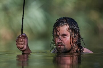 Man lurking in a small lake
