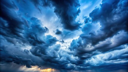 Gloomy blue storm clouds blocking sunlight, stormy, overcast, atmosphere, dramatic, weather, dark, ominous, moody, dramatic, clouds