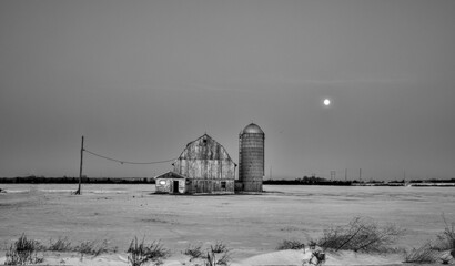  The full moon over a farmers field