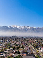 aerial view of Santiago de Chile with the Andes mountain range behind. Financial city, business capital to visit and travel.