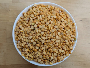 Peas in the white bowl. Top view. Close up