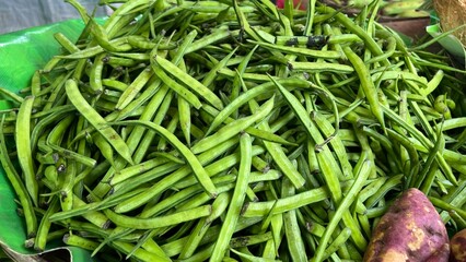 Fresh and raw vegetables the market. Fresh potatoes, bel peppers, tomatoes, zucchini, eggplant and green beans for sale at vegetable market, close up. Organic vegetables at local market.	