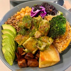 A vibrant poke bowl filled with fresh, marinated fish, rice, and colorful toppings like avocado, seaweed, and sesame seeds. A healthy, satisfying meal with rich textures and flavors.
