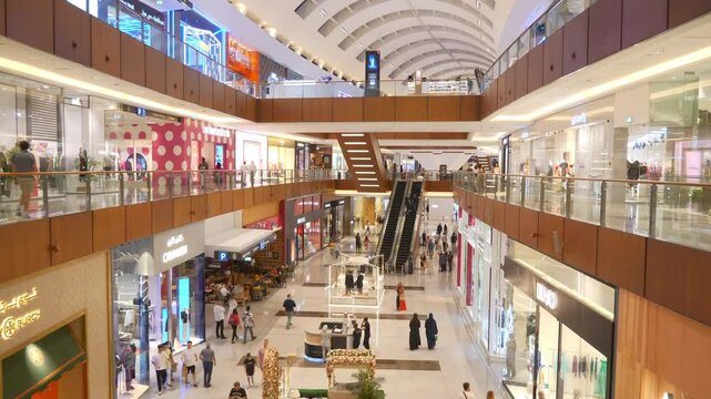 illuminated dubai city mall top floor shopping hall walking pov slow motion panorama 4k uae