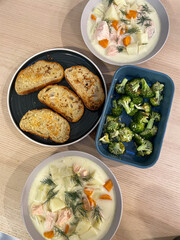 Salmon chowder, garlic bread, and roasted broccoli.