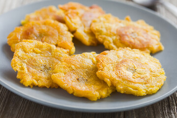 Tostones or patacones, crispy fried plantain slices a typical and traditional Latin American snack...