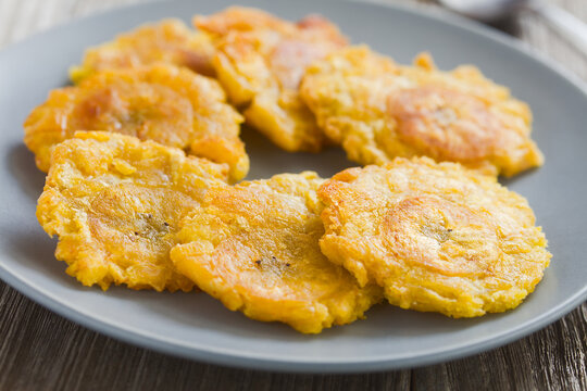 Tostones or patacones, crispy fried plantain slices a typical and traditional Latin American snack and accompaniment (Selective Focus, Focus one third into the image)
