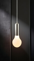 “Hanging Pendant Light on Solid Background” – A single modern pendant light with a glowing bulb, suspended against a solid dark-gray background, evoking sophistication and contemporary style.
