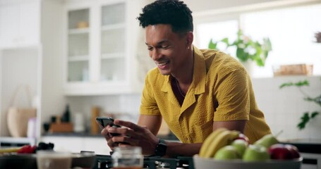 Home, man and smile in kitchen with smartphone on internet or website for smoothie ingredients. Male person, apartment and happy on social media or online for healthy diet tips or instructions