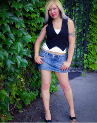 blonde and beautiful woman in the park with tattoos