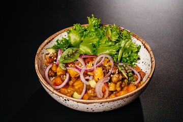 Salad with vegetables and meat on a plate