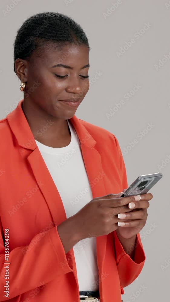 Poster black woman, phone and texting with smile in studio with reading, contact and notification by backgr