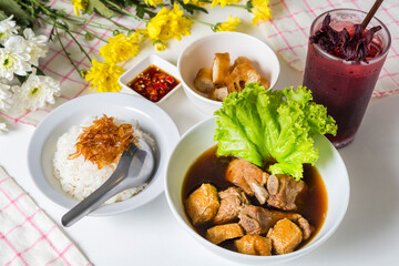 Meal set of braised pork soup with rice and roselle juice on the wood table#6