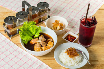 Meal set of braised pork soup with rice and roselle juice on the wood table#8