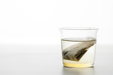 glass of hot tea and tea bag