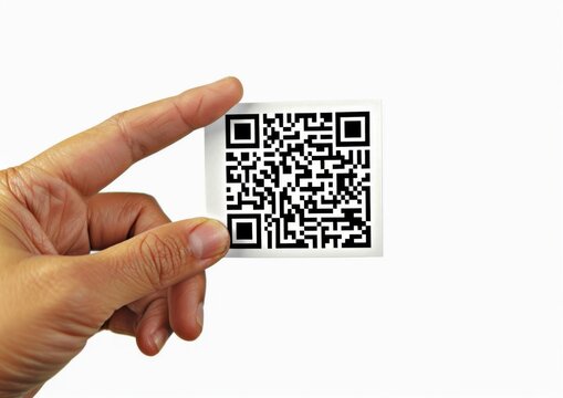 The scene captures a hand with a big QR code, highlighting its role in promoting services or products through technology.