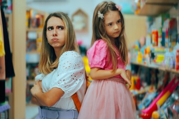 Mother and Daughter Being Angry at Each Other. Mom and little kid having a misunderstanding...