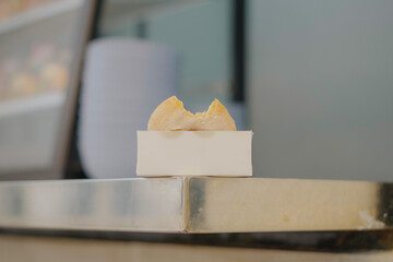 A refreshing iced coffee drink alongside some pastries, perfect for a cafe or breakfast setting. Taken with a shallow depth of field for a modern look.