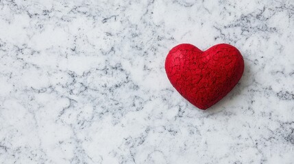 Fototapeta premium Valentine's Day cards concept. Red heart shape on a marble background.