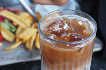Close up of ice cubes in a glass of coffee, 
