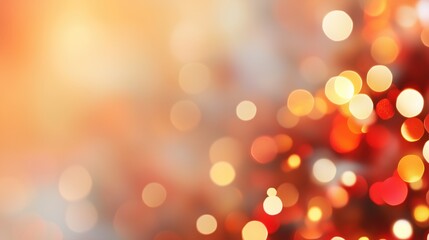 Obraz premium Orange and red bokeh lights on gradient background. Holiday atmosphere concept