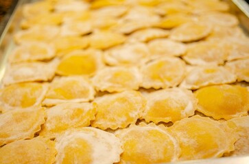 Fresh marubini being prepared according to mazzini gastronomy in cremona, italy