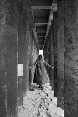 woman walking in the arch