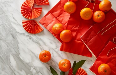 Red gift bags oranges, Chinese fans on white marble table. Lunar New Year decorations. Minimalist design. Celebration, prosperity concept for 2025 holiday season. Beautiful art pieces for festive 
