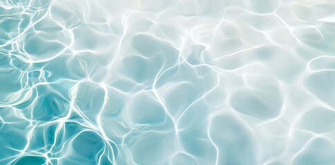 Close-up of gentle ripples on a clear water surface, with faint reflections of light creating a soothing effect.