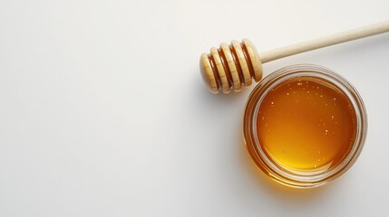 Honey Dipper and Jar on White Background