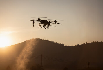 Agricultural Drone Spraying pesticides to increase productivity and destroys harmful insects.
