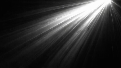 Dynamic black and white abstract background with radiant light bursting from center creating energy and depth.