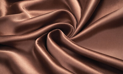Fototapeta premium Elegant smooth coffee, cocoa or brown satin fabric with rich texture. Abstract monochrome elegant luxury silk cloth background. Mocha Mousse color of year 2025.