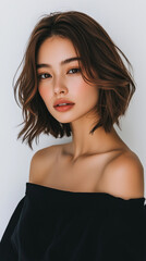 Beautiful woman with bob cut hair posing in front of white background - obrazy, fototapety, plakaty