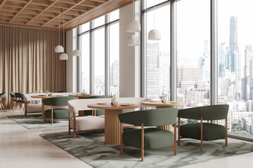 Modern restaurant interior with city view, featuring green chairs, wooden tables, and pendant lights. 3D Rendering