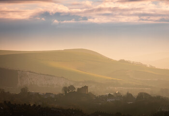 Catching the December sunrise from Lewes Downs with views of Lewes Castle under mount Caburn east Sussex south east England UK © SuxxesPhoto