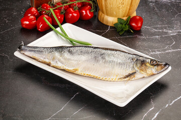 Whole raw salted herring fish