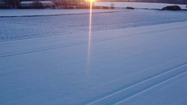 Snow-Covered Landscape at Sunset