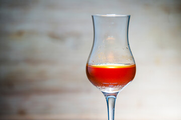 Concept photo of liqueur glass without people with text space