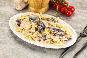 Italian cuisine - farfalle with mushrooms