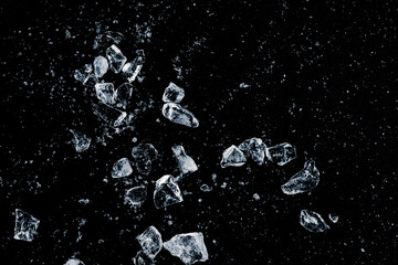 Ice crush on a black background. Chill backdrop.