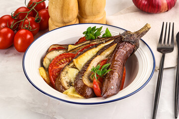 Baked tomato with mozzarella and tomato