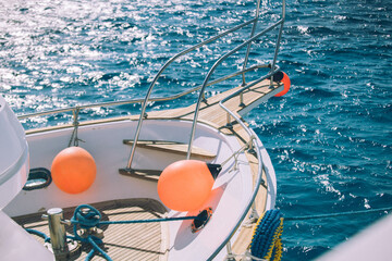Coral yacht fender against dark sea. Boat trip and vacation concept