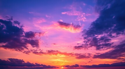 A dramatic sunset with shades of orange, pink, and purple, as the sky transitions into dusk