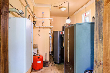 interior apartment room boiler room. heating system, pipes and appliances